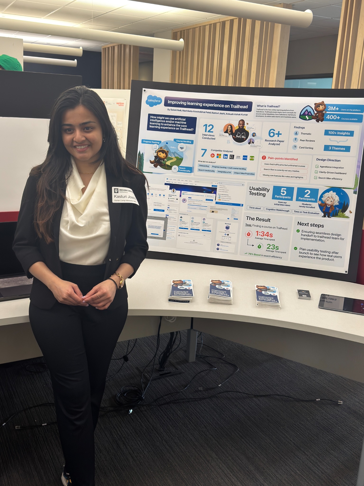 Kasturi presenting the Salesforce Trailhead research poster during an in-person showcase.